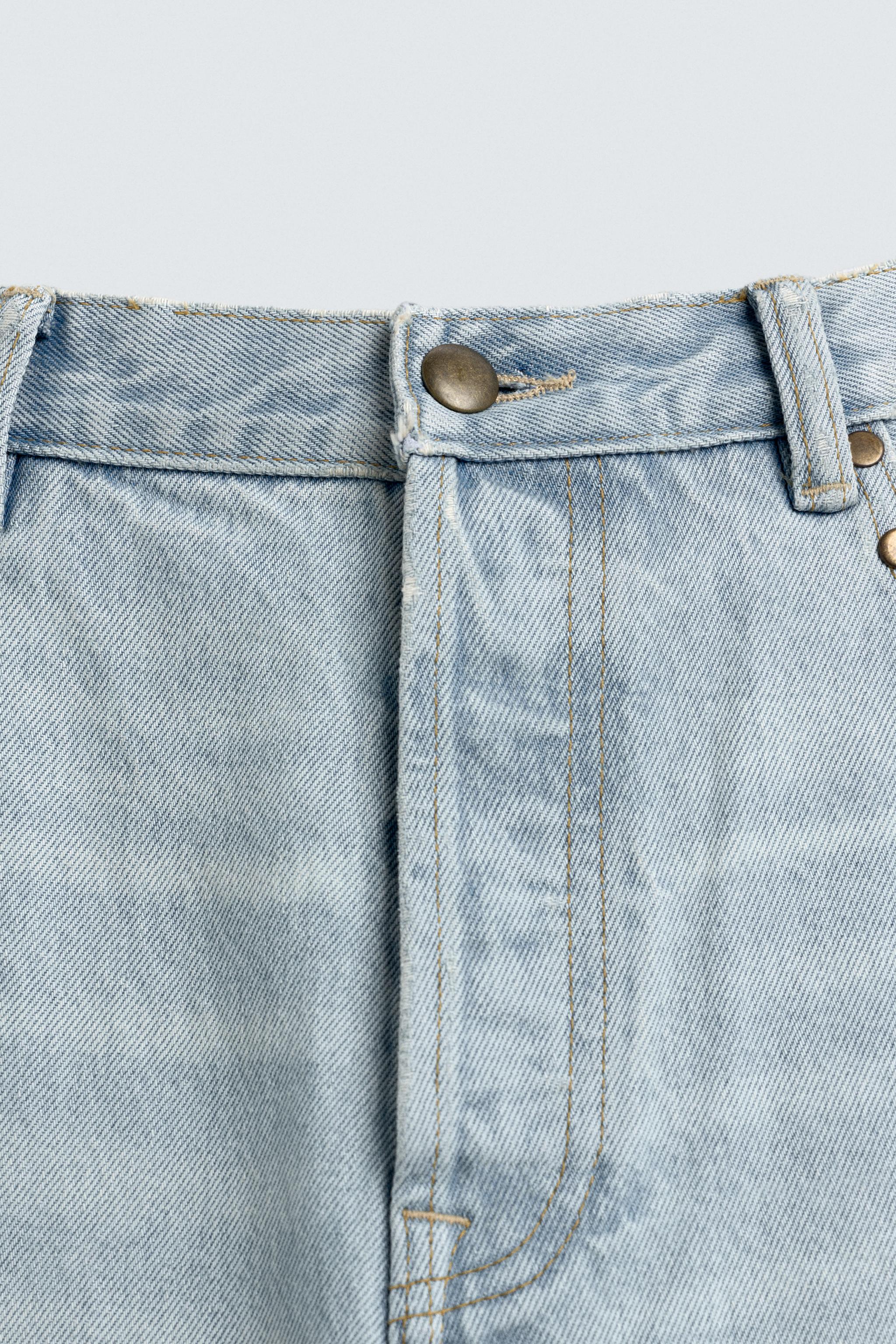 JEAN STRAIGHT FIT CLOUS MÉTALLIQUES